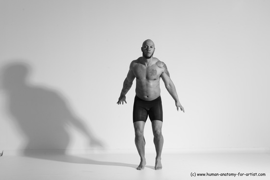 Underwear Gymnastic poses Man Black Muscular Bald Dancing Dynamic poses Academic