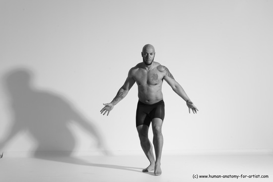 Underwear Gymnastic poses Man Black Muscular Bald Dancing Dynamic poses Academic