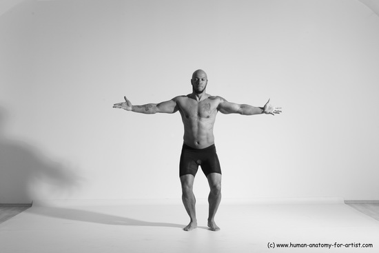 Underwear Gymnastic poses Man Black Muscular Bald Dancing Dynamic poses Academic