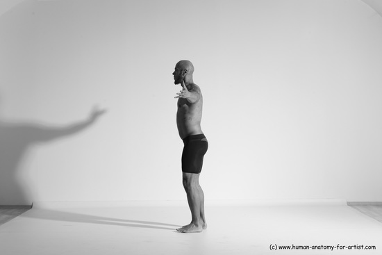 Underwear Gymnastic poses Man Black Muscular Bald Dancing Dynamic poses Academic