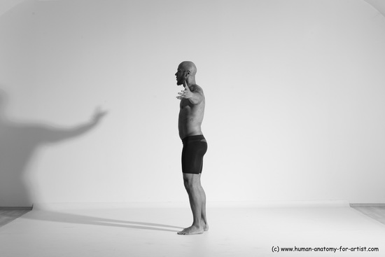 Underwear Gymnastic poses Man Black Muscular Bald Dancing Dynamic poses Academic