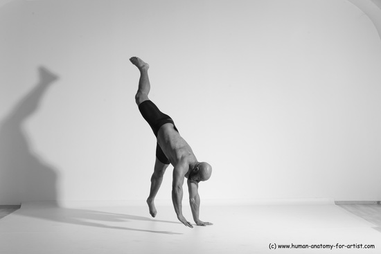 Underwear Gymnastic poses Man Black Muscular Bald Dancing Dynamic poses Academic