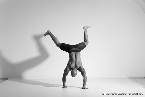 Underwear Gymnastic poses Man Black Muscular Bald Dancing Dynamic poses Academic