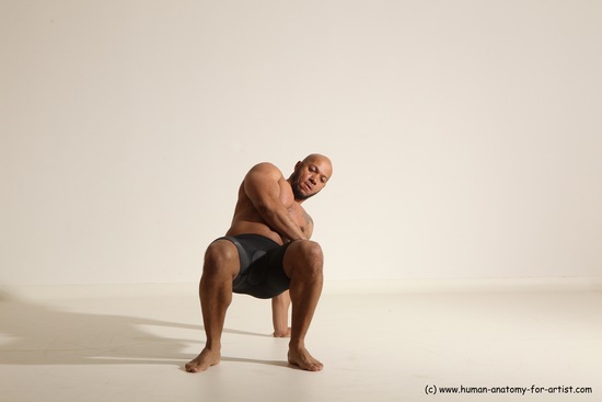 Underwear Gymnastic poses Man Black Muscular Bald Dancing Dynamic poses Academic