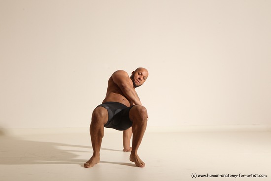 Underwear Gymnastic poses Man Black Muscular Bald Dancing Dynamic poses Academic