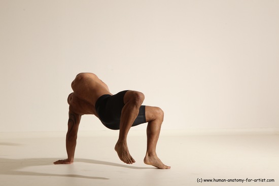 Underwear Gymnastic poses Man Black Muscular Bald Dancing Dynamic poses Academic