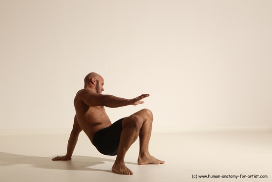 Underwear Gymnastic poses Man Black Muscular Bald Dancing Dynamic poses Academic