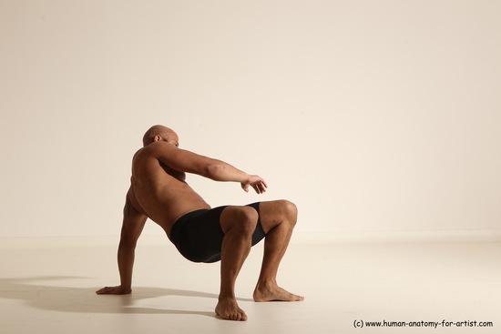 Underwear Gymnastic poses Man Black Muscular Bald Dancing Dynamic poses Academic