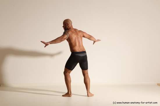 Underwear Gymnastic poses Man Black Muscular Bald Dancing Dynamic poses Academic