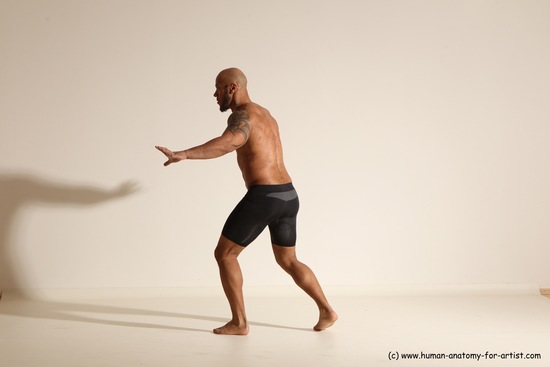 Underwear Gymnastic poses Man Black Muscular Bald Dancing Dynamic poses Academic