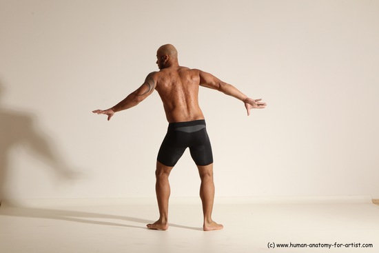 Underwear Gymnastic poses Man Black Muscular Bald Dancing Dynamic poses Academic