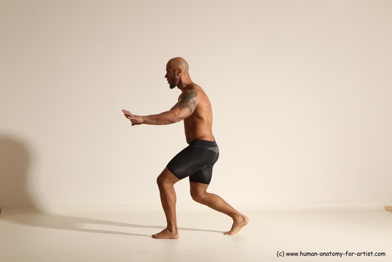 Underwear Gymnastic poses Man Black Muscular Bald Dancing Dynamic poses Academic