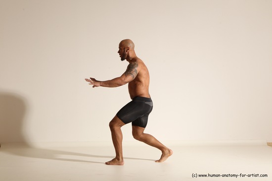 Underwear Gymnastic poses Man Black Muscular Bald Dancing Dynamic poses Academic