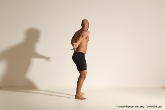 Underwear Gymnastic poses Man Black Muscular Bald Dancing Dynamic poses Academic