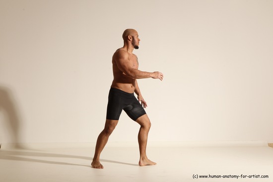 Underwear Gymnastic poses Man Black Muscular Bald Dancing Dynamic poses Academic