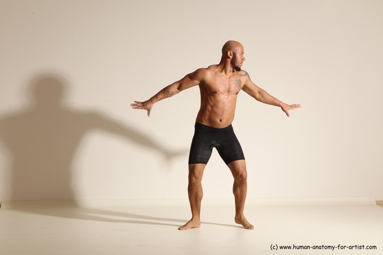 Underwear Gymnastic poses Man Black Muscular Bald Dancing Dynamic poses Academic