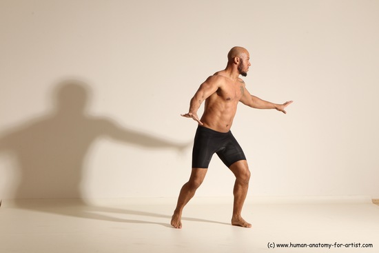 Underwear Gymnastic poses Man Black Muscular Bald Dancing Dynamic poses Academic