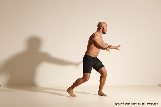 Underwear Gymnastic poses Man Black Muscular Bald Dancing Dynamic poses Academic