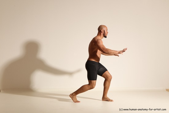 Underwear Gymnastic poses Man Black Muscular Bald Dancing Dynamic poses Academic