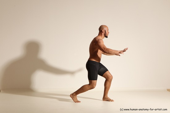 Underwear Gymnastic poses Man Black Muscular Bald Dancing Dynamic poses Academic