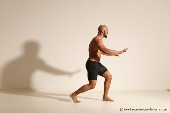 Underwear Gymnastic poses Man Black Muscular Bald Dancing Dynamic poses Academic