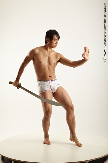 Underwear Fighting with knife Man Asian Average Medium Black Academic