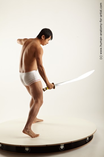 Underwear Fighting with knife Man Asian Average Medium Black Academic