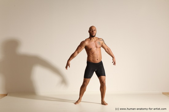 Underwear Gymnastic poses Man Black Muscular Bald Dancing Dynamic poses Academic