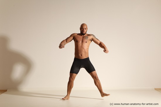 Underwear Gymnastic poses Man Black Muscular Bald Dancing Dynamic poses Academic