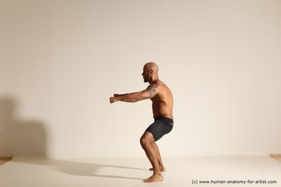 Underwear Gymnastic poses Man Black Muscular Bald Dancing Dynamic poses Academic