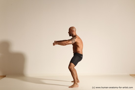 Underwear Gymnastic poses Man Black Muscular Bald Dancing Dynamic poses Academic