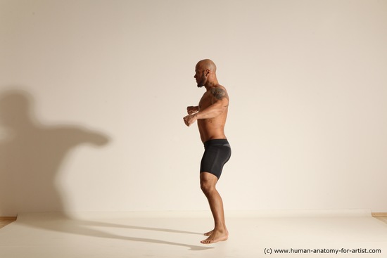 Underwear Gymnastic poses Man Black Muscular Bald Dancing Dynamic poses Academic