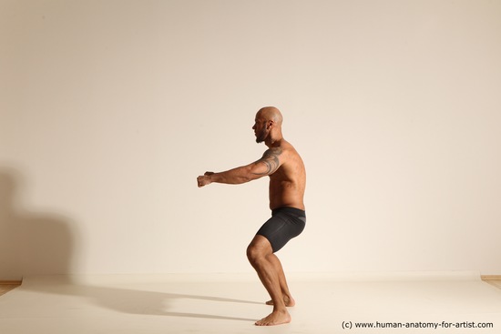 Underwear Gymnastic poses Man Black Muscular Bald Dancing Dynamic poses Academic