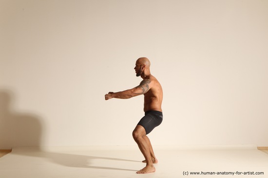 Underwear Gymnastic poses Man Black Muscular Bald Dancing Dynamic poses Academic