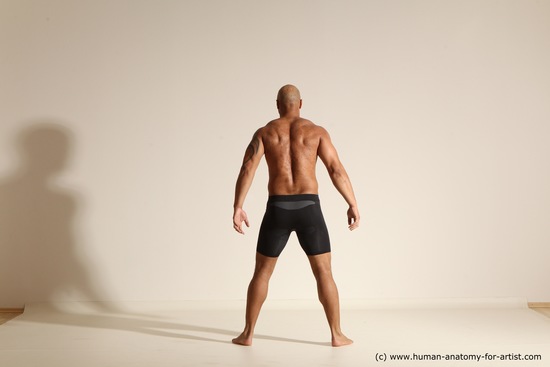 Underwear Gymnastic poses Man Black Muscular Bald Dancing Dynamic poses Academic