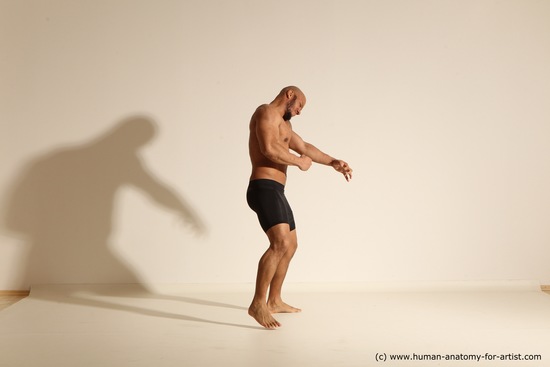 Underwear Gymnastic poses Man Black Muscular Bald Dancing Dynamic poses Academic