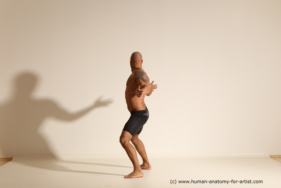 Underwear Gymnastic poses Man Black Muscular Bald Dancing Dynamic poses Academic