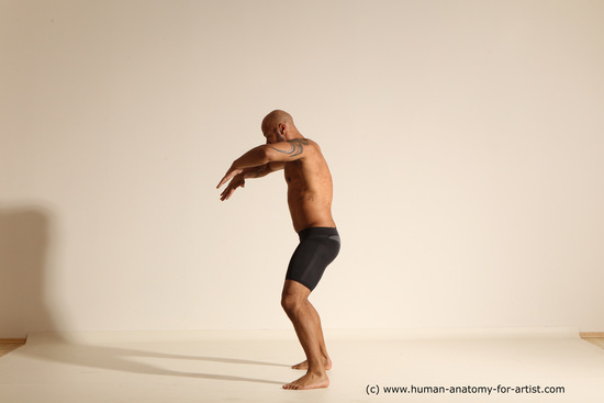 Underwear Gymnastic poses Man Black Muscular Bald Dancing Dynamic poses Academic