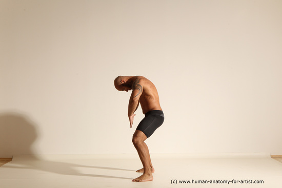 Underwear Gymnastic poses Man Black Muscular Bald Dancing Dynamic poses Academic