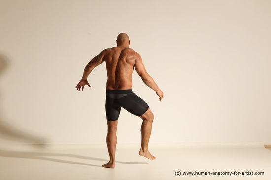 Underwear Gymnastic poses Man Black Muscular Bald Dancing Dynamic poses Academic