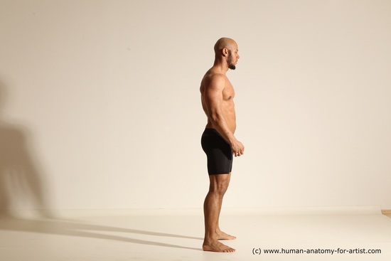 Underwear Gymnastic poses Man Black Muscular Bald Dancing Dynamic poses Academic