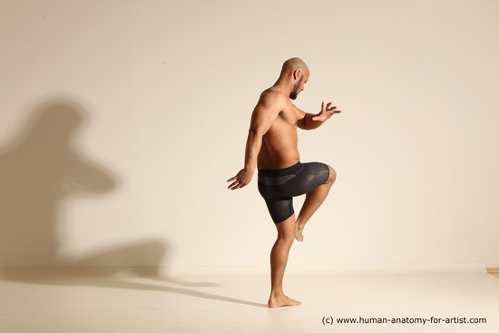 Underwear Gymnastic poses Man Black Muscular Bald Dancing Dynamic poses Academic