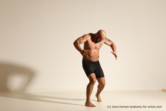 Underwear Gymnastic poses Man Black Muscular Bald Dancing Dynamic poses Academic