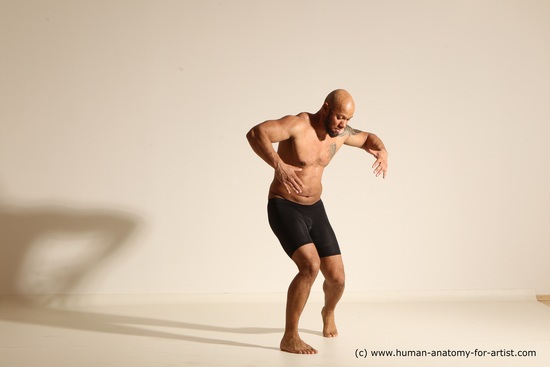 Underwear Gymnastic poses Man Black Muscular Bald Dancing Dynamic poses Academic