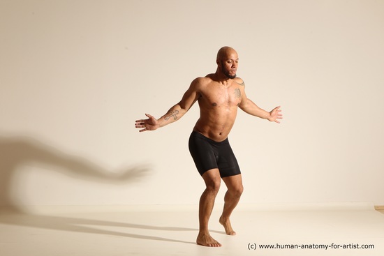 Underwear Gymnastic poses Man Black Muscular Bald Dancing Dynamic poses Academic