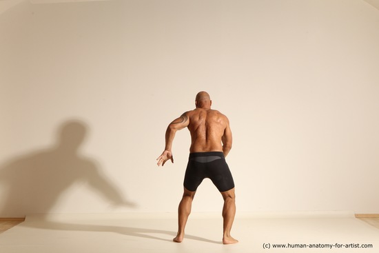 Underwear Gymnastic poses Man Black Muscular Bald Dancing Dynamic poses Academic