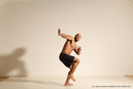 Underwear Gymnastic poses Man Black Muscular Bald Dancing Dynamic poses Academic