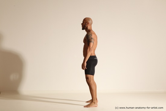 Underwear Gymnastic poses Man Black Muscular Bald Dancing Dynamic poses Academic