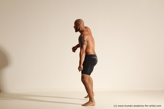 Underwear Gymnastic poses Man Black Muscular Bald Dancing Dynamic poses Academic