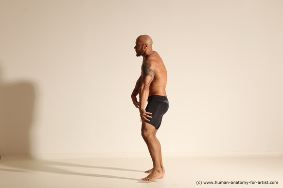 Underwear Gymnastic poses Man Black Muscular Bald Dancing Dynamic poses Academic